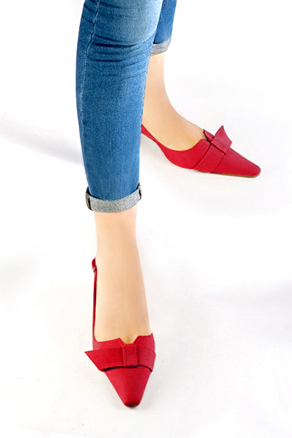 Women's cardinal red elegant slingback heels, with a bow on the front. Tapered toe. Medium spool heels - Worn view
